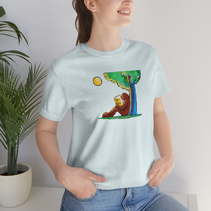 Bigfoot Reading How to Mingle Unisex Soft Cotton T-Shirt