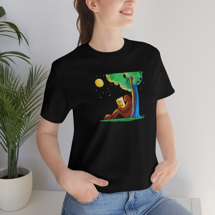 Bigfoot Reading How to Mingle Unisex Soft Cotton T-Shirt