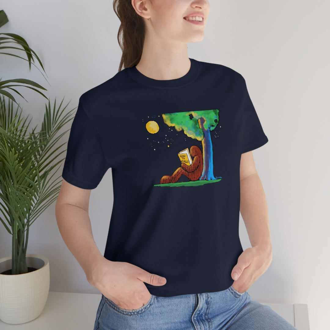 Bigfoot Reading How to Mingle Unisex Soft Cotton T-Shirt