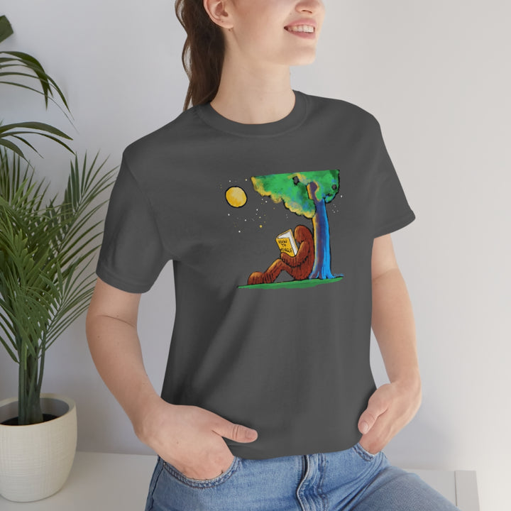 Bigfoot Reading How to Mingle Unisex Soft Cotton T-Shirt